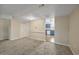 Inviting living room showcasing neutral paint, plush carpet, and seamless flow to the kitchen at 2701 Hillside Dr. S # 1, North Myrtle Beach, SC 29582