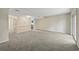 Expansive living area with sliding glass doors, neutral paint, and modern carpeting at 2701 Hillside Dr. S # 1, North Myrtle Beach, SC 29582
