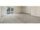 Spacious living area with sliding glass doors offering natural light and backyard views at 2701 Hillside Dr. S # 1, North Myrtle Beach, SC 29582