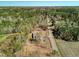 Aerial view of single-story home featuring a large yard with mature trees and storage shed at 2917 Chippenham Rd., Marion, SC 29571