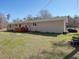 Side view of a home showing a well-maintained lawn at 2917 Chippenham Rd., Marion, SC 29571