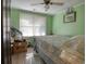 Cozy bedroom with light green walls, one window, and a ceiling fan at 2917 Chippenham Rd., Marion, SC 29571