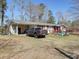 Single-story home featuring a convenient carport and a truck parked in the driveway at 2917 Chippenham Rd., Marion, SC 29571