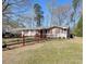 Charming ranch home with a red-picket fence and spacious front yard at 2917 Chippenham Rd., Marion, SC 29571