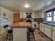 Bright kitchen with stylish cabinetry, laminate flooring, and spacious countertops at 2917 Chippenham Rd., Marion, SC 29571