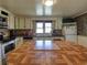 Functional kitchen with countertops, a large wooden table, and updated appliances at 2917 Chippenham Rd., Marion, SC 29571