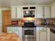 Traditional kitchen with stainless steel appliances, green trim and light countertops at 2917 Chippenham Rd., Marion, SC 29571