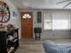 Bright living room features hardwood floors, vintage decor, and sunlit windows at 2917 Chippenham Rd., Marion, SC 29571