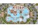 Stunning aerial view of a community pool with a lazy river, lap pool, and lounge areas at 2993 Moss Bridge Ln., Myrtle Beach, SC 29579
