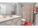 Bathroom featuring a single vanity, decorated shower curtain, and neutral colored paint and flooring at 2993 Moss Bridge Ln., Myrtle Beach, SC 29579