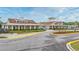 Community clubhouse featuring a welcoming entrance, covered walkways, and lush landscaping at 2993 Moss Bridge Ln., Myrtle Beach, SC 29579