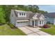 Charming home with a two-car garage, landscaped front yard, and welcoming front porch at 2993 Moss Bridge Ln., Myrtle Beach, SC 29579