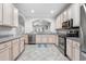 Spacious kitchen featuring ample cabinets, granite countertops, and stainless steel appliances at 2993 Moss Bridge Ln., Myrtle Beach, SC 29579