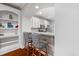 Stylish kitchen bar area with granite countertop, seating, and views of the adjacent living area at 2993 Moss Bridge Ln., Myrtle Beach, SC 29579