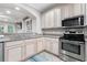 Well-lit kitchen featuring granite countertops, stainless appliances, and a view into the living area at 2993 Moss Bridge Ln., Myrtle Beach, SC 29579