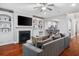 Inviting living room with fireplace, built-in shelves, hardwood floors, and an open layout at 2993 Moss Bridge Ln., Myrtle Beach, SC 29579
