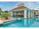 Stunning poolside lounge offers shade and comfort, with beautiful palm trees nearby at 2993 Moss Bridge Ln., Myrtle Beach, SC 29579