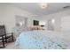 Serene bedroom with floral bedding, white dresser, and comfortable seating area at 315 Cattle Drive Circle, Myrtle Beach, SC 29588