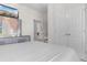 Bright bedroom features double doors, a TV, and an open view of a dressing area at 315 Cattle Drive Circle, Myrtle Beach, SC 29588