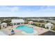 Large community pool with ample seating and a great view of the neighborhood lake at 315 Cattle Drive Circle, Myrtle Beach, SC 29588