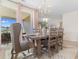 Dining area with a wooden table and chairs, and sliding glass doors to the outdoor patio at 315 Cattle Drive Circle, Myrtle Beach, SC 29588