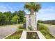 Community entrance sign for Farm at Timberlake with lush landscaping and a water feature at 315 Cattle Drive Circle, Myrtle Beach, SC 29588