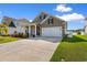 Charming home with a two-car garage, well-maintained landscaping, and inviting curb appeal at 315 Cattle Drive Circle, Myrtle Beach, SC 29588