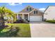 Charming single-Gathering home featuring a well-manicured lawn and an attached two-car garage at 315 Cattle Drive Circle, Myrtle Beach, SC 29588