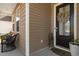 Inviting front porch with decorative wreath, neutral paint and stylish outdoor seating at 315 Cattle Drive Circle, Myrtle Beach, SC 29588