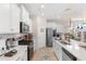 Bright, modern kitchen with white cabinets, stainless steel appliances, and a large island at 315 Cattle Drive Circle, Myrtle Beach, SC 29588