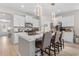 Stylish kitchen featuring a large island with seating, stainless appliances and pendant lights at 315 Cattle Drive Circle, Myrtle Beach, SC 29588