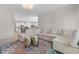 Cozy living area with a sectional sofa, decorative tables, and an open view to the kitchen at 315 Cattle Drive Circle, Myrtle Beach, SC 29588