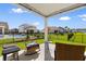 Covered patio with outdoor seating overlooking the backyard with a view of the pool at 315 Cattle Drive Circle, Myrtle Beach, SC 29588