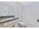 This bathroom features a tub shower combo, a vanity with granite countertop, and modern fixtures at 3550 Pampas Dr. # 2, Myrtle Beach, SC 29577