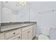Granite countertops accent this bathroom that has a large mirror, tile floors, and a toilet at 3550 Pampas Dr. # 2, Myrtle Beach, SC 29577