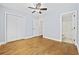 The spacious bedroom has hardwood floors, a ceiling fan, and easy access to an ensuite bathroom at 3550 Pampas Dr. # 2, Myrtle Beach, SC 29577