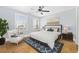 Bedroom with wood floors, ceiling fan, sitting chair, and picture window views at 3550 Pampas Dr. # 2, Myrtle Beach, SC 29577