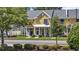 Attractive yellow townhome boasts professional landscaping and inviting front entrance at 3550 Pampas Dr. # 2, Myrtle Beach, SC 29577