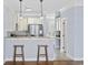 Kitchen area with bar seating, stainless appliances, and stone countertops at 3550 Pampas Dr. # 2, Myrtle Beach, SC 29577