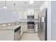 Kitchen with stainless steel appliances, granite countertops, and classic white cabinetry at 3550 Pampas Dr. # 2, Myrtle Beach, SC 29577