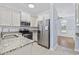 Galley kitchen with stainless steel appliances, granite countertops, and ample storage at 3550 Pampas Dr. # 2, Myrtle Beach, SC 29577