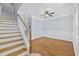 Living area showing stairs and hardwood floors, with crown molding and ceiling fan at 3550 Pampas Dr. # 2, Myrtle Beach, SC 29577