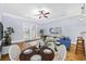 Open-concept living area with wood floors, ceiling fan, and sliding glass doors to the outside at 3550 Pampas Dr. # 2, Myrtle Beach, SC 29577