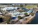 Aerial view of a colorful playground with shade structures and surrounding park amenities at 3550 Pampas Dr. # 2, Myrtle Beach, SC 29577