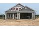 New construction gray home featuring an attached two-car garage and covered porch at 3597 Valley Forge Rd., Aynor, SC 29511
