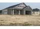 Newly built home exterior shows a covered porch, two-car garage, and backyard at 3597 Valley Forge Rd., Aynor, SC 29511