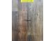 Highlight oak laminate flooring sample showing the color and style of planks at 3597 Valley Forge Rd., Aynor, SC 29511