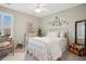 Charming bedroom featuring a wrought iron bed, natural light, and tasteful decor at 417 Pennington Loop, Myrtle Beach, SC 29588