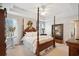 Serene bedroom with a four-poster bed, soft lighting, and a calming color palette at 417 Pennington Loop, Myrtle Beach, SC 29588