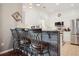 Bright kitchen area featuring white cabinets, stainless steel appliances, granite countertops, and bar stool seating at 417 Pennington Loop, Myrtle Beach, SC 29588